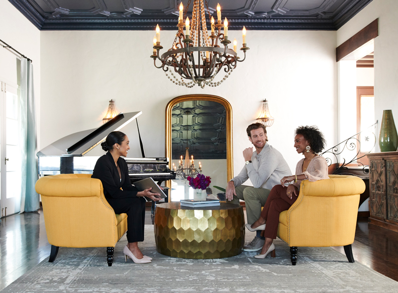 Buyers speaking with an agent